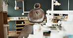 Dental, chair and empty room with equipment for treatment services, medical facility and oral care. Dentistry, clinic interior or private practice with furniture for orthodontics, workspace or health