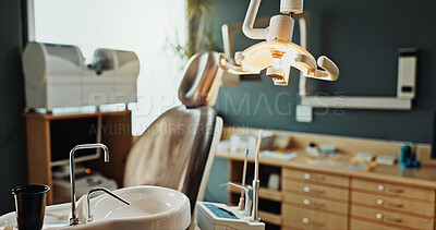 Buy stock photo Dental, sink and empty room with light for treatment services, healthcare facility and oral care. Dentistry, clinic interior and private practice with equipment for orthodontics, workspace or health