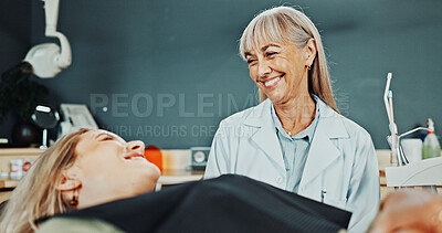 Buy stock photo Women, dentist and happy patient in clinic for dental treatment, tooth extraction or appointment. Female person, orthodontist or smile on chair for teeth cleaning or oral healthcare in dentistry