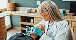 Consulting, clinic and dentist with woman and mirror for teeth cleaning, oral hygiene and medical service. Healthcare, patient and orthodontist with tools for dental care, appointment and wellness