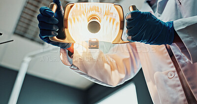 Buy stock photo POV, hands and dentist with light for dental procedure, extraction service or periodontal treatment. Dentistry, person or surgical lamp in clinic for cavity inspection, restorative care or low angle