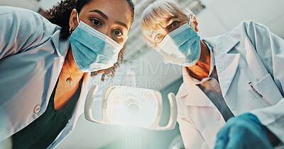 Buy stock photo Dentist, light and pov with cleaning in hospital for oral care, service and medical consultation. Dentistry, mature woman and low angle with equipment for dental hygiene, appointment and teamwork
