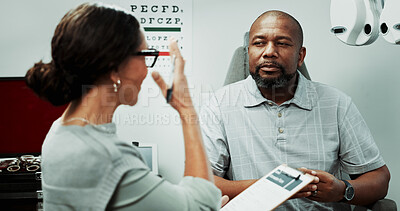 Buy stock photo Optometry, consulting and man in clinic talking for sight, vision and results for eye exam. Healthcare, clipboard and optician with patient for checkup, medical report and ophthalmology appointment