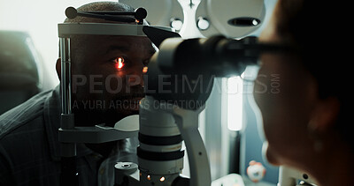 Buy stock photo Optometry, patient and slit lamp for eye exam, retina check or diagnostic for structural health. Vision, optometrist or man with light in dark clinic for glaucoma test, iris assessment or healthcare
