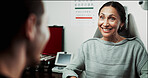 Optometry, consulting and woman in clinic talking for eye exam, testing vision and eyesight. Healthcare, happy and optician with patient for checkup, medical service and ophthalmology appointment
