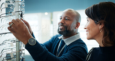 Buy stock photo Man, optometrist and customer with glasses in store for recommendation or frame suggestion. Male person, sales representative or optometry shop with spectacles for client vision, sight or choice