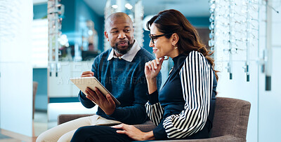 Buy stock photo Optician, woman or tablet in shop for consulting, digital lookbook and advice on glasses upgrade. Happy, mature customer and optical assistant with tech for frame planning, color options or decision