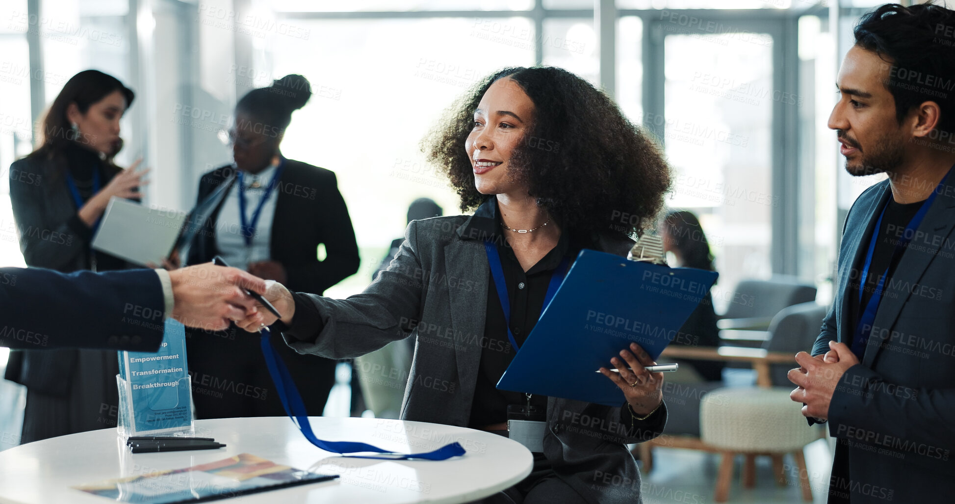 Buy stock photo Woman, conference and handover lanyard at meeting, attendee registration and empowerment workshop. Smile, people and giving badge for event pass, transformation seminar or guest access clipboard