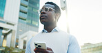 Phone, thinking and black man in city for texting, email or communication for update on finance report. Technology, planning and financial manager on cellphone for feedback on investment un town.
