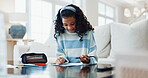 Happy, girl and education with homework for learning, school assessment or academic development. Learner, student or child studying with paper or stationery for exam, test or assignment in house