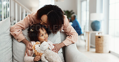 Buy stock photo Mother, kiss and daughter at house with love, affection and interaction for bonding together. Woman, embrace and child in lounge with teddy bear, parental care and family connection for weekend break