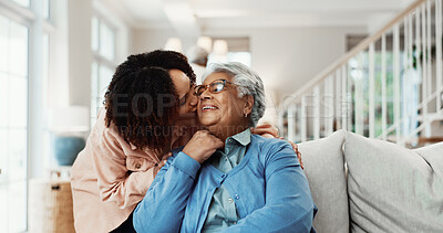 Buy stock photo Family, kiss and woman with senior mother in lounge, love or bonding with daughter on break in home. Happy person, support and affection for elderly parent, together and connection with mom in house
