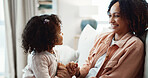 Smile, mother and holding hands at house with child, love and playful interaction for bonding. Happy, woman and playing games in lounge with kid, parental care and family connection for weekend break