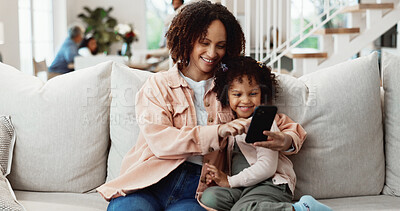 Buy stock photo Phone, mother and child in home for bonding, online game or connection with happy parent. Mobile, girl and mama on sofa to play with gaming app, relax together or care with daughter in family house