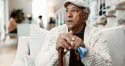 Buy stock photo Thinking, walking stick and senior man on sofa in home with reflection or reminder of retirement. Serious, wooden cane and elderly person in living room for planning pension in apartment on weekend.