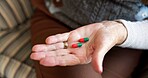 Medicine, pills and hands of old woman on chair for prescription, medical and supplements. Healthcare, wellness and vitamins with elderly person in living room of home for pharmacy and retirement