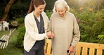 Nurse, walking stick and senior woman in outdoor garden for mobility, exercise or support together. Elderly, female person or caregiver helping patient with cane for assisted living or balance