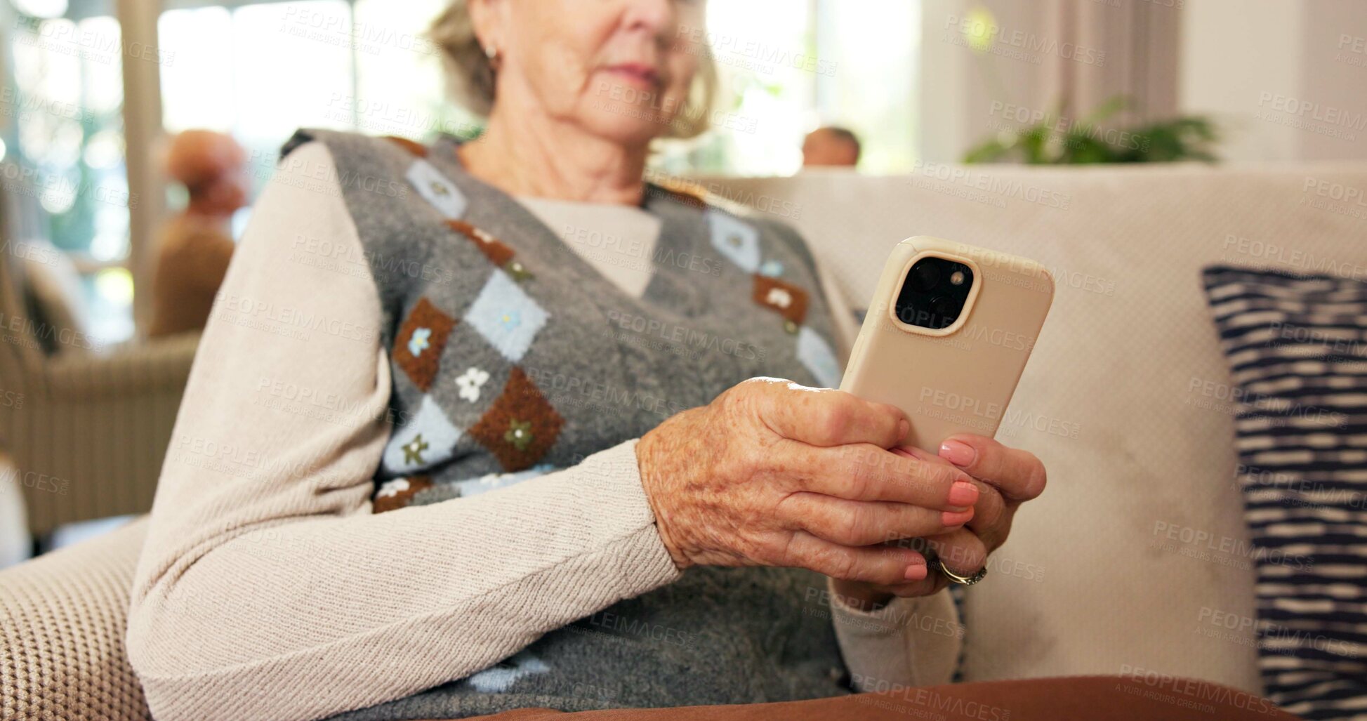 Buy stock photo Phone, typing and senior woman in home with texting, email or reading blog on retirement on app. Technology, relax and elderly person with cellphone for chatting on website in living room at house.