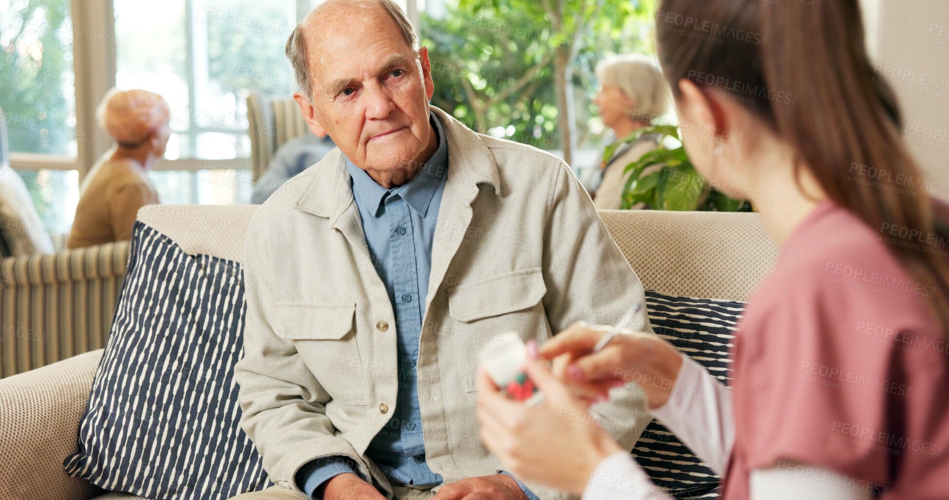 Buy stock photo Senior, man and nurse with pills in retirement home for medication or pharmaceutical advice. Elderly, male person or caregiver talking to patient with tablets for medical help, cure or treatment