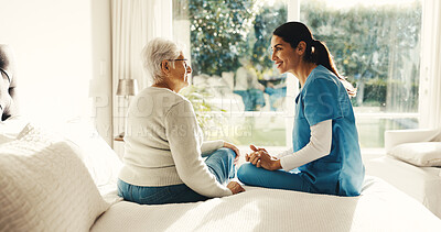 Buy stock photo Senior, woman and nurse with patient in retirement home for medical help or assisted living. Female person, healthcare worker or caregiver talking with smile for elderly care or nursing in bedroom