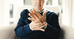 Senior, man and hands with wrist pain in retirement home for carpal tunnel syndrome or arthritis. Elderly, male person or sore arm with joint inflammation or discomfort for fibromyalgia in house