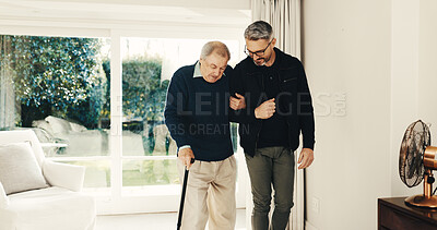 Buy stock photo Cane, man and help senior dad in home for mobility support, hip surgery recovery or fall prevention. Walking stick, adult son and old father with disability for joint rehabilitation, balance and care