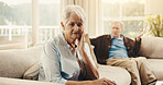 Fighting, upset and senior woman on sofa in home with argument, disagreement or divorce on weekend. Stress, couple and elderly person in living room with marriage fail, breakup or conflict in house.