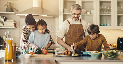 Buy stock photo Parents, kids and happy with cooking in kitchen of home for bonding, teaching and support. People, family and smile and help on preparing dinner with ingredients or vegetable for child development