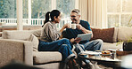 Tablet, cheers and couple with coffee on sofa in home with planning budget, savings or finance research. Happy, digital technology and man with woman in living room for discussion for investment.