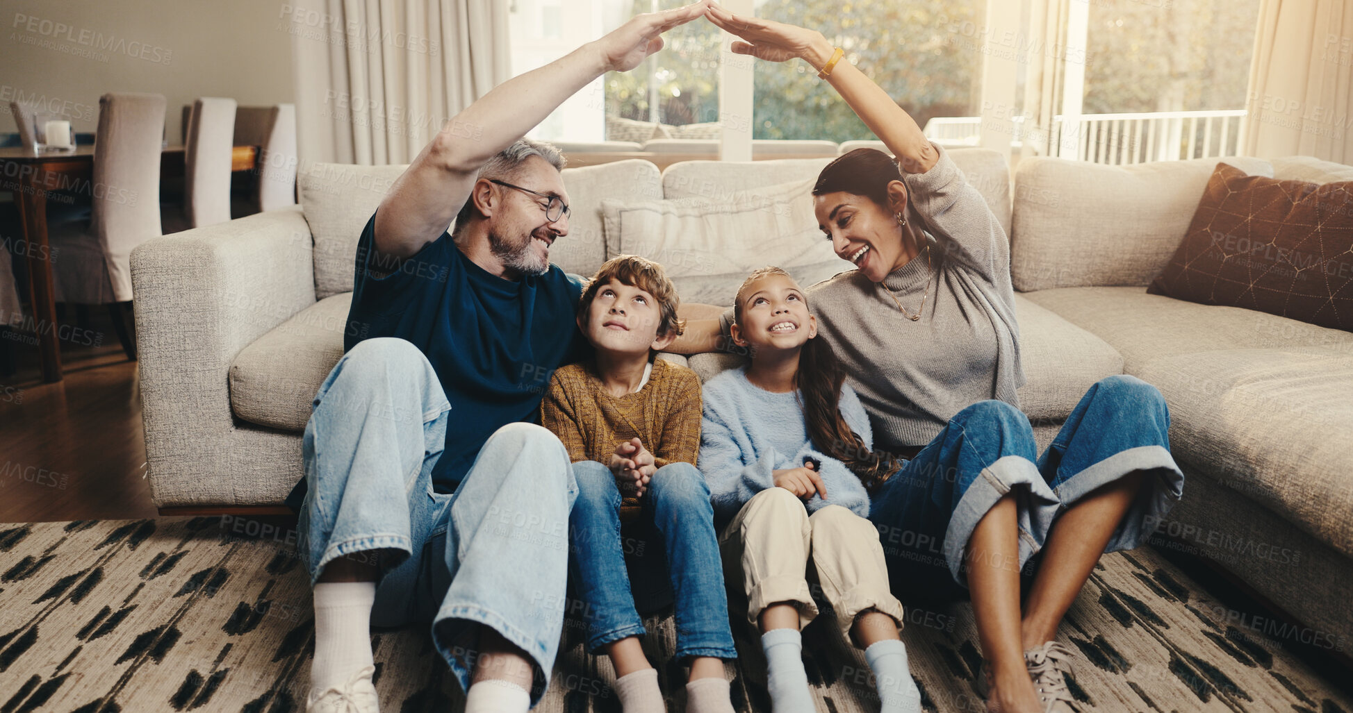 Buy stock photo Parents, children and insurance with roof for family, support and security with people in home together. Man, woman and happy with kids, protection and safety with bonding, connection and life cover