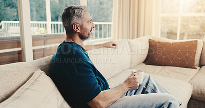 Buy stock photo Coffee, relax and thinking with man in living room of home for contemplation or reflection. Drink, me time and break with mature person in apartment for inspiration, nostalgia or perspective