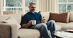 Happy, man and relax at house with phone, social media and browsing online for latest movies. Smile, mature person and coffee in home with mobile app, internet search and streaming for film watchlist