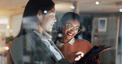 Buy stock photo Business, women and night in office with tablet, research and proofreading story for submission. Smile, people and team working late in workplace with digital, copywriting report and article deadline