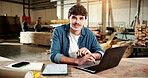 Carpenter, portrait and man with laptop in workshop, online or research for furniture design on web. Manufacturing, factory and happy person with technology, info and planning for woodworking project