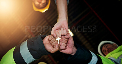 Buy stock photo Hands, fist bump and engineer with people in warehouse for solidarity, architecture and meeting. Construction, mission and low angle of employees in factory for property development and achievement