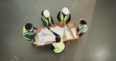 Buy stock photo Architect, people or handshake with blueprint for construction agreement or building deal together. Top view, group or contractors shaking hands with documents for architecture project or partnership