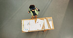 Woman, architect and dancing with headphones on construction site for building project or vibe. Top view, female person or civil engineer listening with documents for audio streaming or productivity