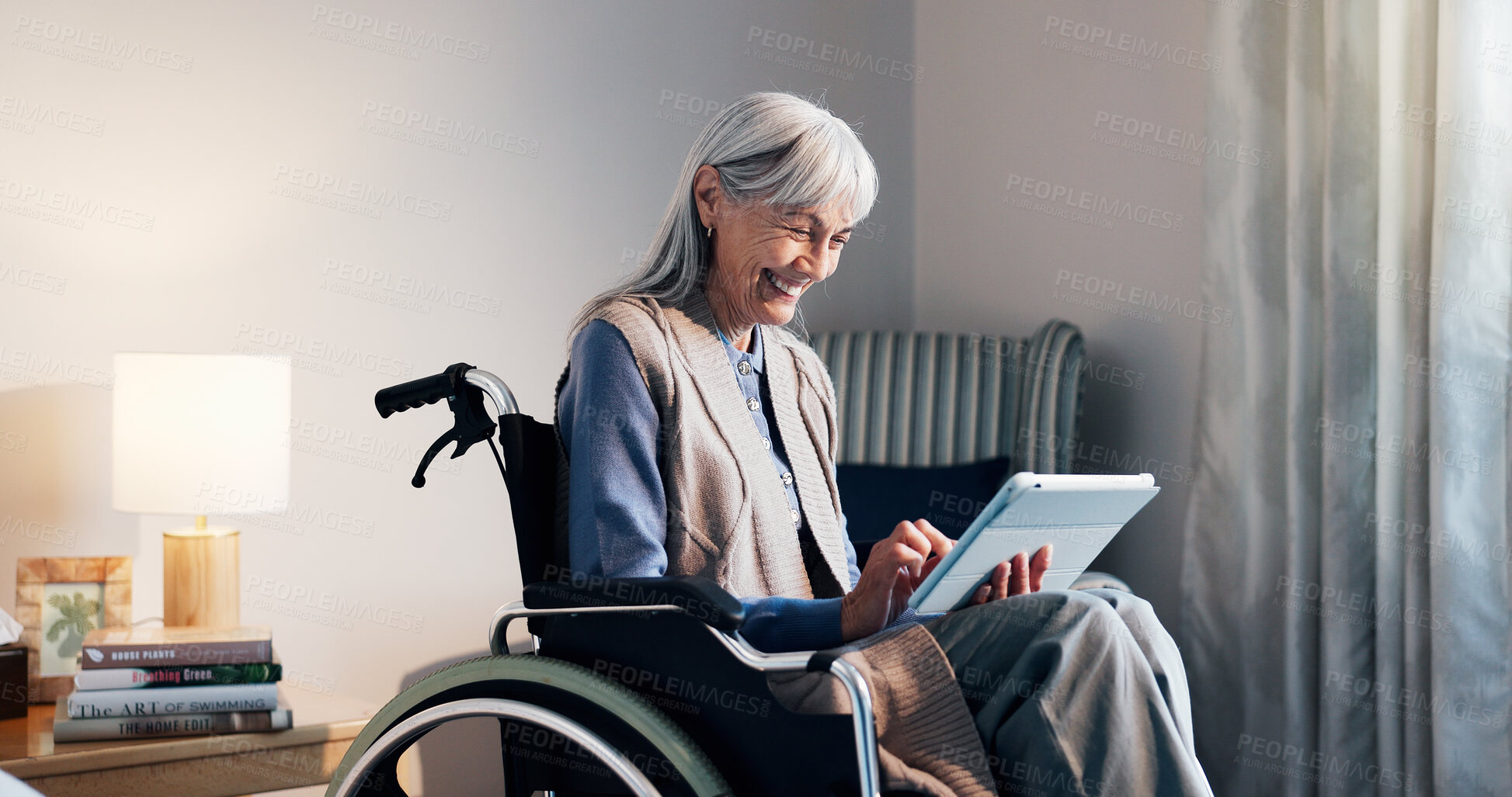 Buy stock photo Smile, tablet and wheelchair with old woman in retirement home for streaming service or subscription. App, happy and senior person with disability in bedroom for digital download or watching video