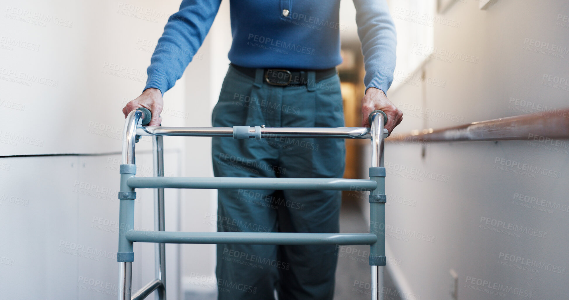 Buy stock photo Hands, woman and walking at facility with walker, support and mobility aid for injury recovery. Medical, healing and person with disability, gait training and balance assistance for physical therapy