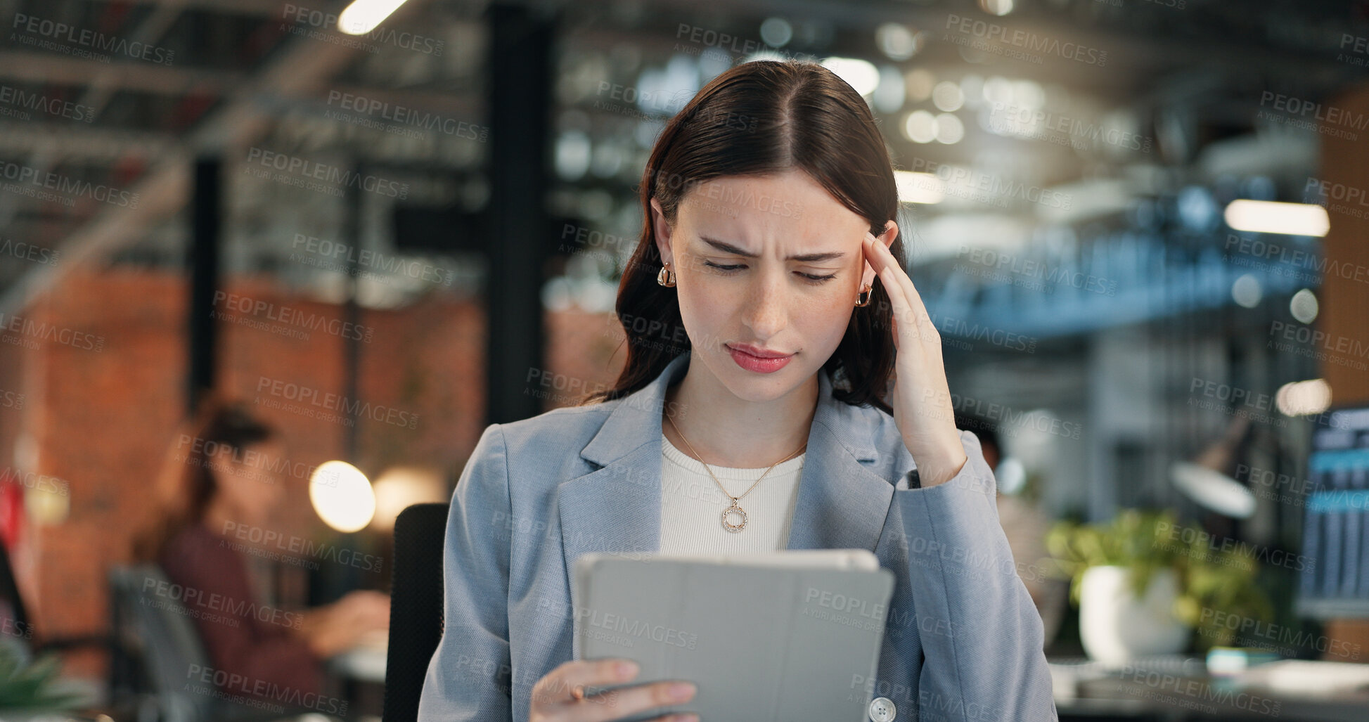 Buy stock photo Woman, stress and headache with tablet in office for overworked strain, pressure or discomfort. Tired, female person or employee with migraine for work tension, app or business deadline in workplace
