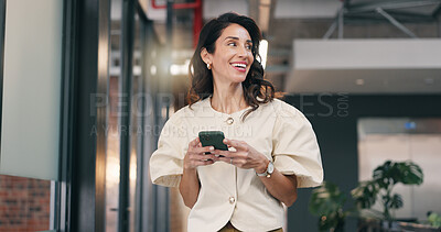 Buy stock photo Businesswoman, thinking and laughing with phone in office, creative or planning for campaign on web. Marketing manager, reflection and mature person with mobile, brand awareness and happy with tech