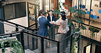 Hands, stack and business people in green office for meeting, solidarity and synergy for goals. Stairs, team and men with women in huddle for support, mission or collaboration for sustainable company