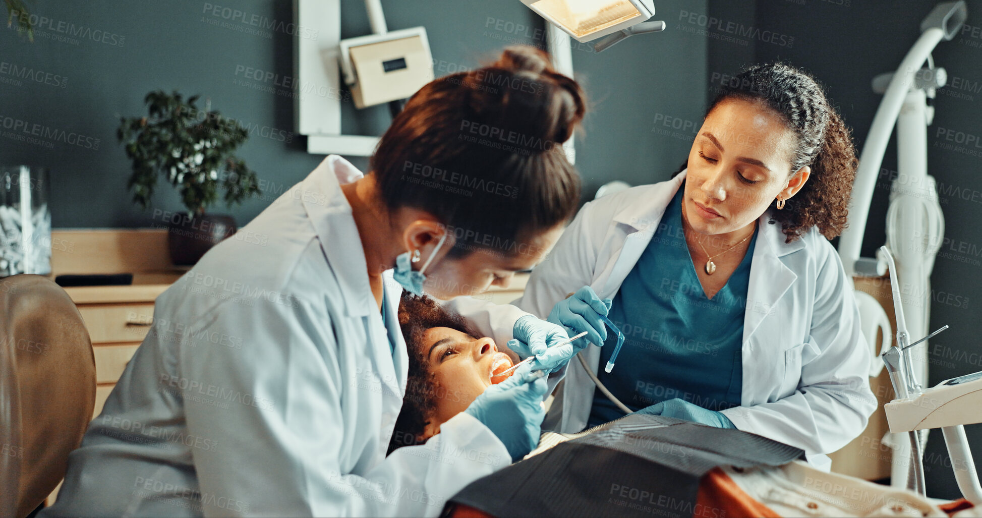 Buy stock photo Assistant, checkup and dentist in office with patient for dental procedure or oral operation. Appointment, healthcare and surgery with people in dentistry practice for professional tooth extraction