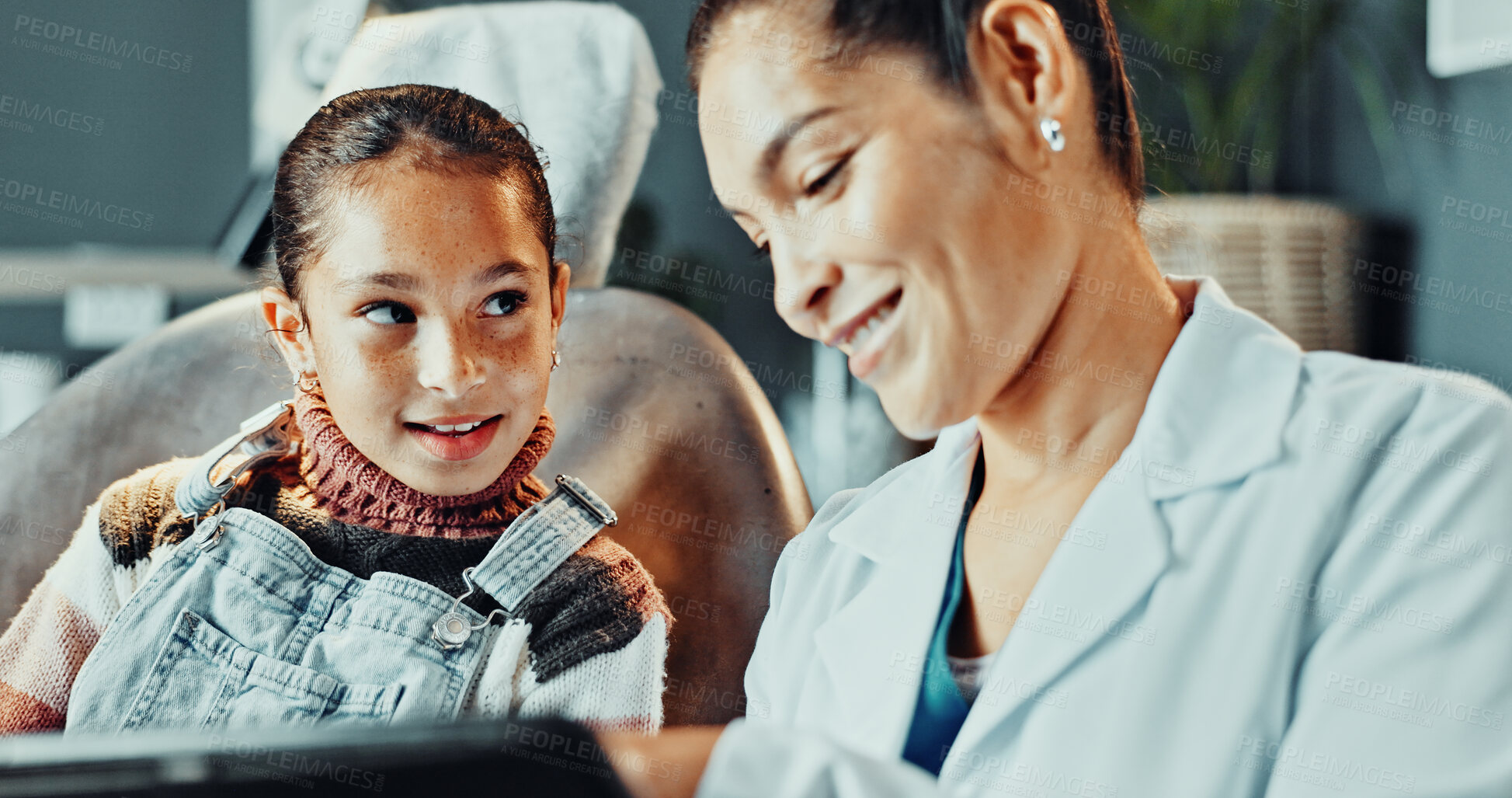 Buy stock photo Dentist, child and tablet in clinic with consultation, education and discussion for dental hygiene. Oral hygienist, girl and talk in office with tech, medical help or kid learning about orthodontics.