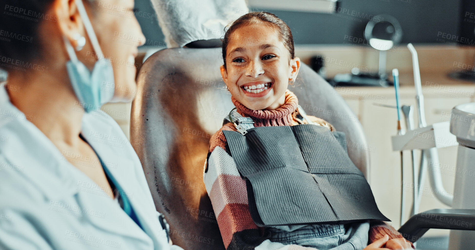 Buy stock photo Girl, happy and dentist in practice for healthcare, bravery and ready for dental procedure. child patient, orthodontist and teeth smile in office for consultation, gum wellness and treatment service 
