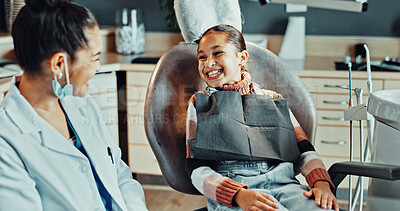 Buy stock photo Child, happy and dentist in practice for appointment, bravery and ready for dental procedure. Girl patient, orthodontist and teeth smile in office for consultation, gum wellness and treatment service