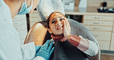 Buy stock photo Girl, patient and tooth pain with dentist in clinic for dental surgery or extraction appointment. Discomfort, child or kid with orthodontist, sore gum or toothache for gingivitis, cavity or decay