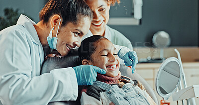 Buy stock photo Appointment, assistant and dentist in office with girl child for dental care or oral hygiene. Healthcare, results and smile with happy people in dentistry practice for checkup or tooth whitening