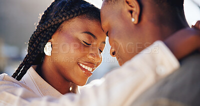 Buy stock photo Forehead, touch and happy couple on break, outdoor and connection with partner and bonding together. Black people, embrace and smile with spouse on weekend, relationship and relax on anniversary