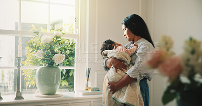 Buy stock photo Mother, window and relax with baby girl in living room with hug, bonding and connection with love. People, mom and child for rest, reflection or relationship for security or support in family home
